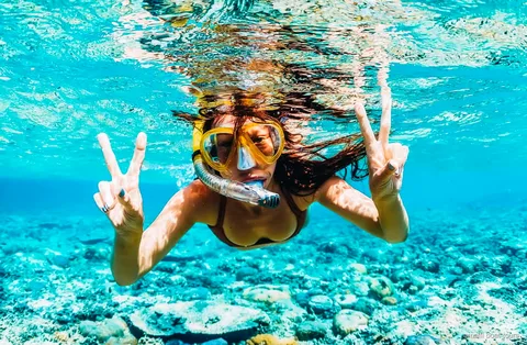 Amalfi Coast boat tour guests snorkeling near Fiordo di Furore