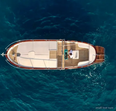 Private Amalfi Coast boat tour guests swimming near the Emerald Grotto